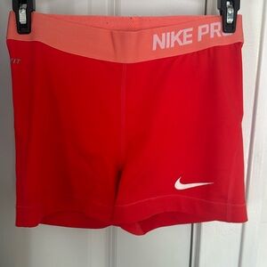 Pink/red nike pro